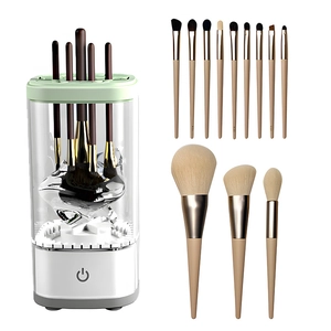 Automatic electric makeup brush cleaner set with white base and green top on white background