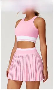Close-up of seamless light pink ribbed fabric with white striped elastic on waist and hem