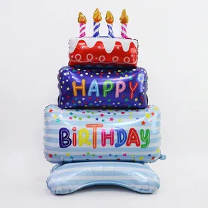 Giant three-tier birthday cake foil balloon with colorful patterns and candles
