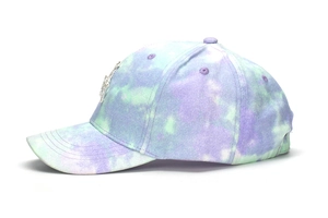 Detail of kids baseball cap featuring pastel tie-dye fabric and rhinestone star emblem
