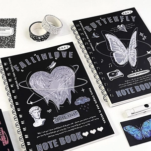 Detail of A5 black spiral notebook featuring Y2K butterfly and liquid heart art design