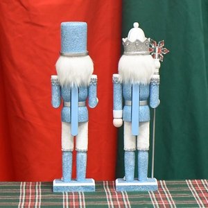 Two blue glitter wooden nutcracker figures in 30cm size for Christmas holiday decoration