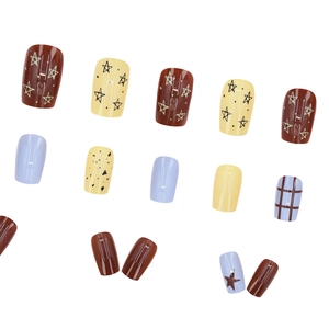 Short square press-on nails with star patterns, plaid designs, and cream blue colors