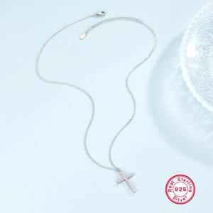 Detailed view of S925 sterling silver cross pendant with sparkling cubic zirconia stones