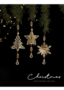 Golden iron Christmas tree, star, and snowflake pendants with crystal beads on pine branch