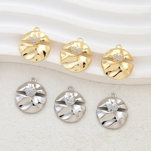 Golden and silver heart zircon button pendants for DIY jewelry making on white background
