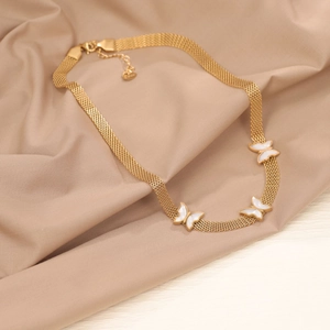 Elegant gold butterfly charm mesh chain necklace displayed on beige silk fabric
