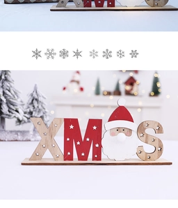 Detail of wooden XMAS tabletop ornament featuring Santa Claus and glowing festive letters