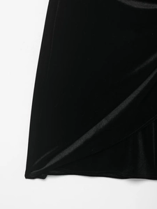 Detail of luxurious black velvet fabric showing soft texture and rich material gloss