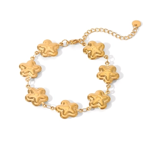 Detailed view of a gold floral and star charm bracelet with adjustable lobster clasp closure