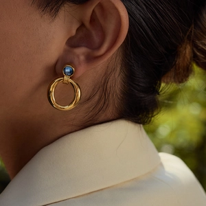 Elegant 18K gold plated stainless steel hoop earrings with blue zircon on model