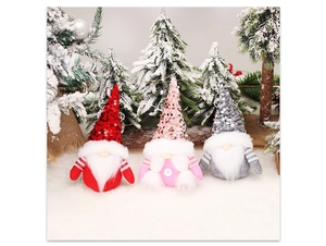 Detailed view of handmade Christmas gnomes with sparkling sequins and long white beards