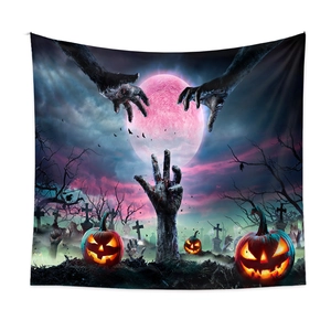Close-up of Halloween tapestry with zombie hands, glowing pumpkins, and a pink moon