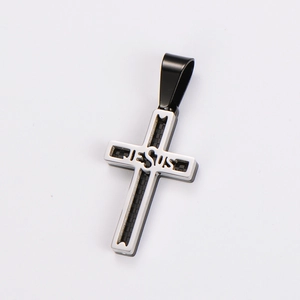 Macro detail of stainless steel cross pendant with cutout Jesus lettering and black inlay