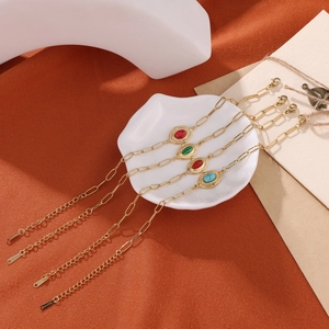 Set of four vintage stainless steel gold-plated bracelets with colorful oval gemstones