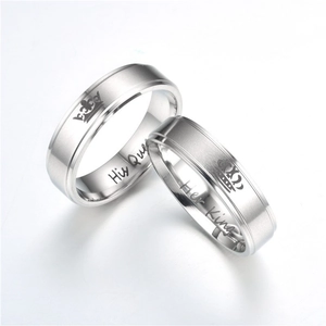 Close-up detail of Her King and His Queen couple rings with royal crown engraving