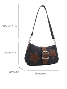 Blue denim shoulder bag with leather star details and product dimensions shown