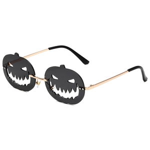 Halloween pumpkin-shaped rimless sunglasses with black lenses and gold metal temples