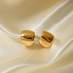 Classic 18k gold plated stainless steel square stud earrings on beige silk fabric