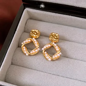 Elegant 18K gold plated square pearl stud earrings displayed in a luxury velvet jewelry box