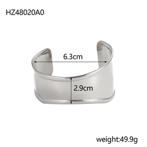 Macro detail of wide silver stainless steel cuff bracelet with 6.3cm inner diameter