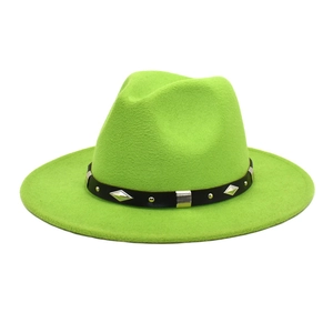 Detail of neon green wool fedora hat featuring a black belt with silver metal rivets