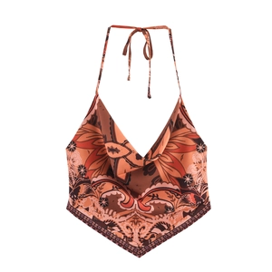 Detail of vintage paisley scarf top with halter neck and brown orange pattern