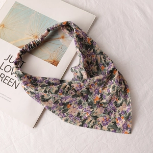 Detail of floral chiffon triangle hair bandana with purple and green tie-dye print