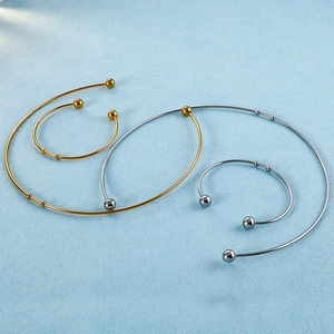 Exaggerated stainless steel open choker necklace set in gold and silver finish with ball ends