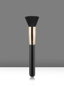 Flat top foundation brush featuring dense black synthetic bristles and a golden ferrule