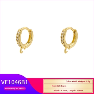 Detail of gold brass huggie earring components with pave cubic zirconia for DIY jewelry