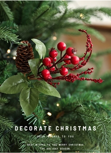 Macro detail of Christmas pine cone picks with red berries and lush green leaves