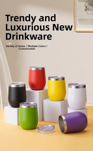 Macro view of six colorful 12oz stainless steel wine tumblers with clear lids on white blocks