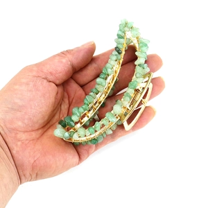 Handmade gold metal banana hair claw clip with wrapped green crystal stone chips