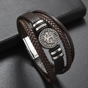 Close-up of multilayer dark brown leather bracelet with silver anchor charm and metal clasp