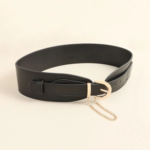 Detail of wide black leather belt featuring gold buckle and hanging decorative chain