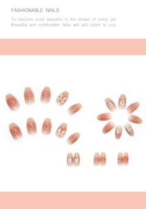 Detail of pink gradient press-on nails with 3D bows, pearls and sparkling glitter
