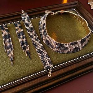 Luxury leopard print jewelry set with rhinestones in a green velvet display box
