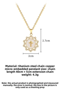 Detail of gold cross pendant necklace with micro-paved crystals and titanium steel chain