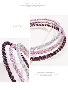 Detailed view of handmade crystal beaded headbands in purple, pink, and silver tones