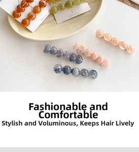 Flat lay of colorful jelly-toned heart and bead hair clips in various pastel resin finishes