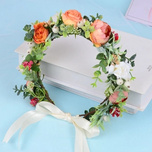 Floral bridal hair comb with peach roses, white blossoms, and yellow silk ribbon