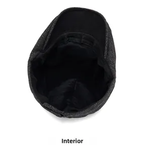 Detail view of the warm fleece lining and adjustable strap inside the wool newsboy hat