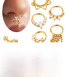 Detailed view of titanium steel hinge rings with zircon stones and tassel pendants