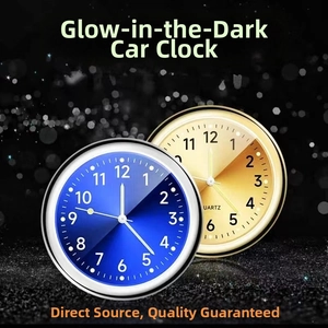Luminous quartz car dashboard clock in blue and gold alloy finish showing detailed dial