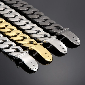 Detail view of Cuban link bracelets in silver, gold, and matte black steel finishes