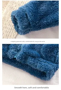 Detail of navy plush kids jacket showing high-quality zipper and elastic cuffs