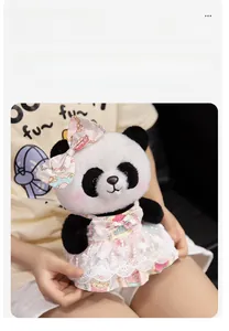 Close-up of cute panda plush in pink floral princess dress with lace detailing