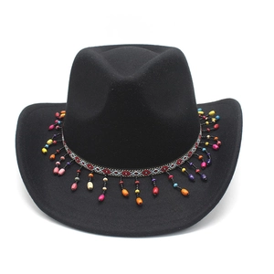 Detail of wool western cowboy hat featuring ethnic patterned band with colorful bead tassels