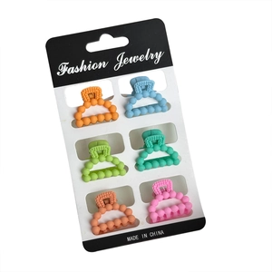 Set of six colorful matte mini ball hair claws for women in pastel macaron shades